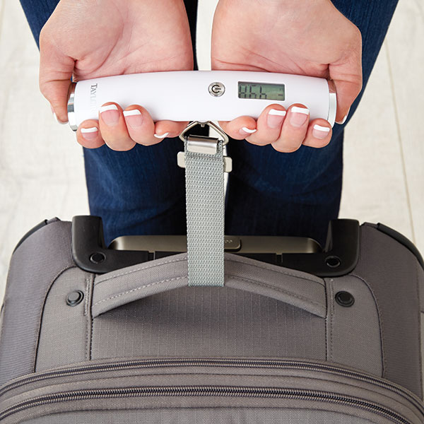 5 Must-Pack Things For Every Trip, Savvy Traveler Tips, What to Pack, luggage scale, two handed luggage scale, digital luggage scale