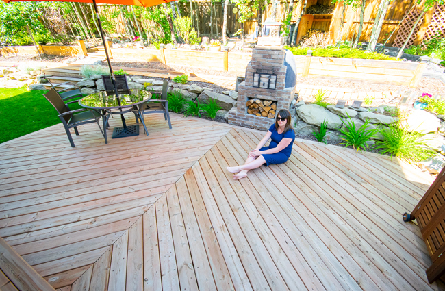 chevron patterned deck, large deck design, outdoor kitchen, herringbone patterned deck, wood fired pizza oven, backyard deck design