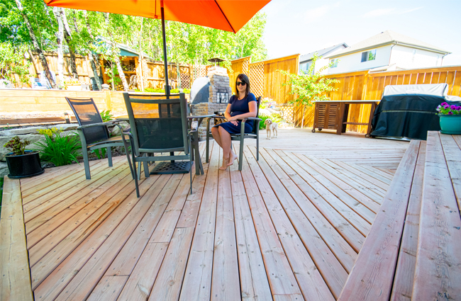 chevron patterned deck, large deck design, outdoor kitchen, herringbone patterned deck, wood fired pizza oven, backyard deck design