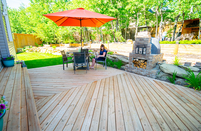 chevron patterned deck, large deck design, outdoor kitchen, herringbone patterned deck, wood fired pizza oven, backyard deck design