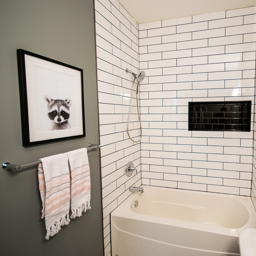 bathroom makeover, bathroom before and after, subway tile shower, shower niche, hex tile floor, tile source calgary, main bathroom, black and white bathroom, bathroom tile, shower tile, tub surround tile, classic bathroom design, bathroom renovation