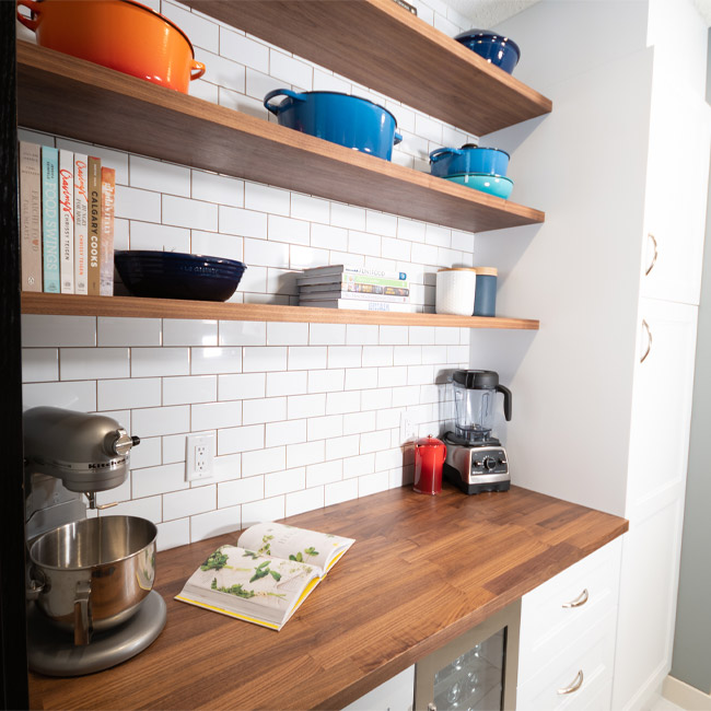 open shelving pantry, farmhouse pantry, custom floating shelves, diy floating shelves, walnut floating shelves, butlers plantry, subway tile pantry, walnut butcher block counter, ikea counter, ikea countertop, le creuset cookware, how to display le creuset cookware, how to display cookware, shelf styling pantry, pantry shelf style, pantry shelfie, cookbook display, coffee bar, kitch custom shelves