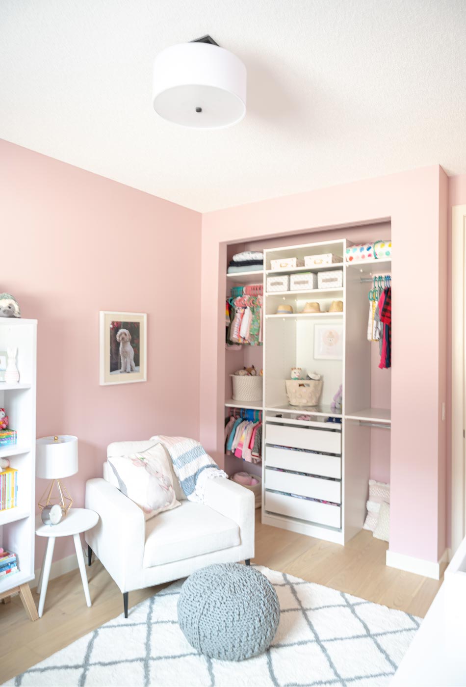 pink nursery, feminine nursery, baby girl room, baby girl nursery, white crib, white crib pink walls, pink walls nursery, modern feminine nursery, modern girls room, modern baby girl room, pompom curtains nursery, IKEA PAX Wardrobe hack, IKEA PAX Wardrobe nursery closet, 