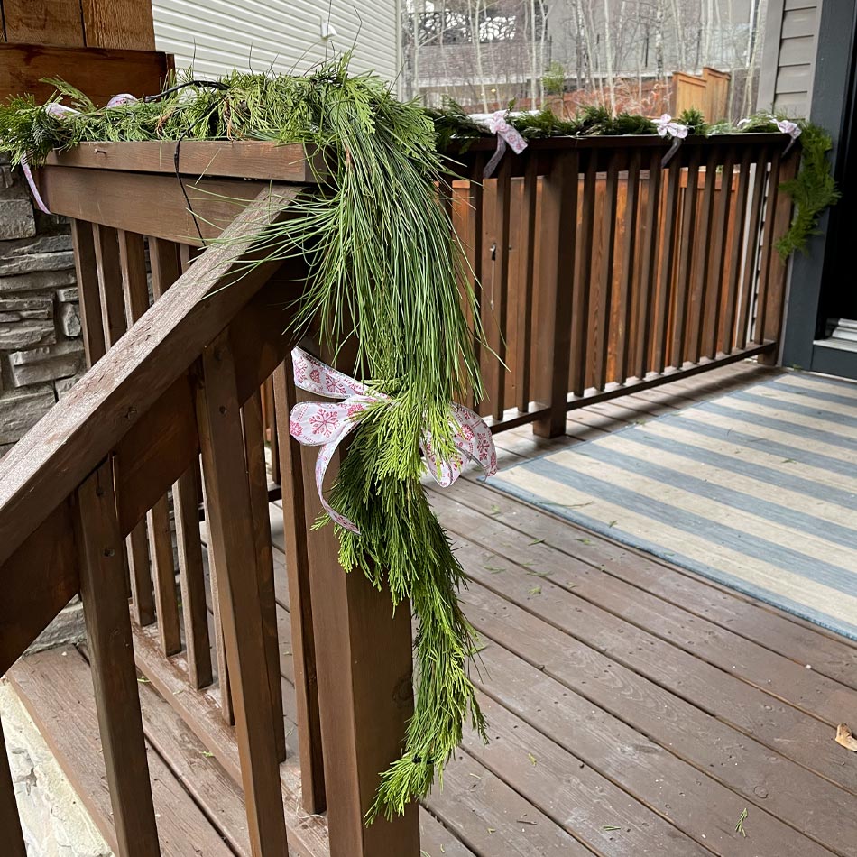 holiday front door, natural greenery holiday, pine garland, cedar garland, greenery garland holiday porch, how to decorate your porch, simple porch decor for Christmas, Christmas wreath, Christmas porch decor